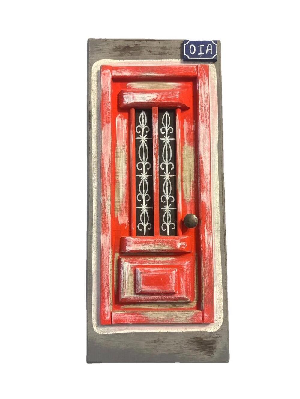 Traditional Red Greek Door From The Village of Oia on Santorini Island